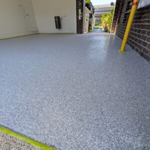 Decorative flake epoxy garage flooring with non-slip coating in Pakenham.