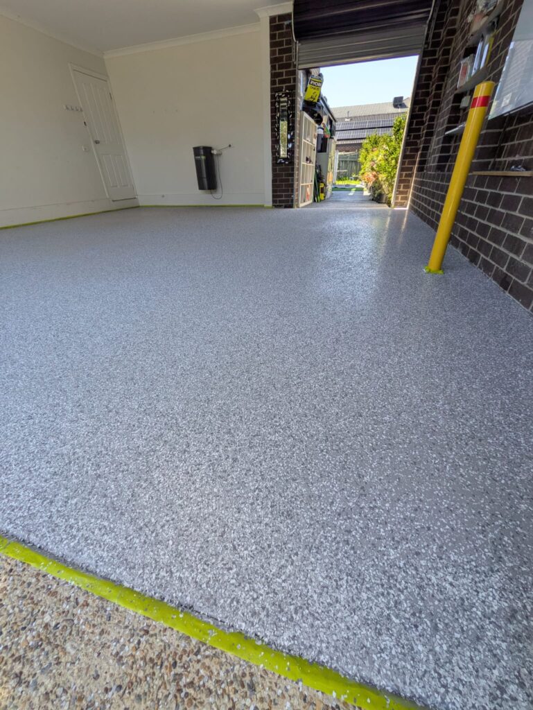 Decorative flake epoxy garage flooring with non-slip coating in Pakenham.