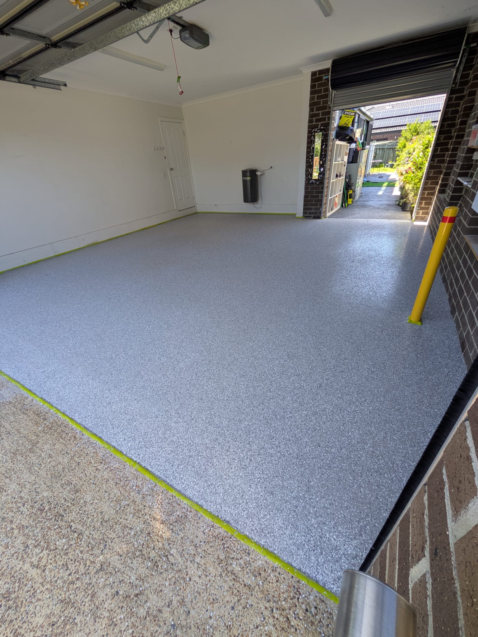 Stylish flake finish garage epoxy flooring for modern Pakenham garages.